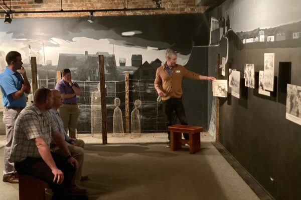 Matt Simpson leading a group tour in the museum